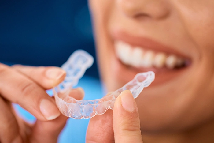 close-up-of-woman-using-invisible-dental-aligners