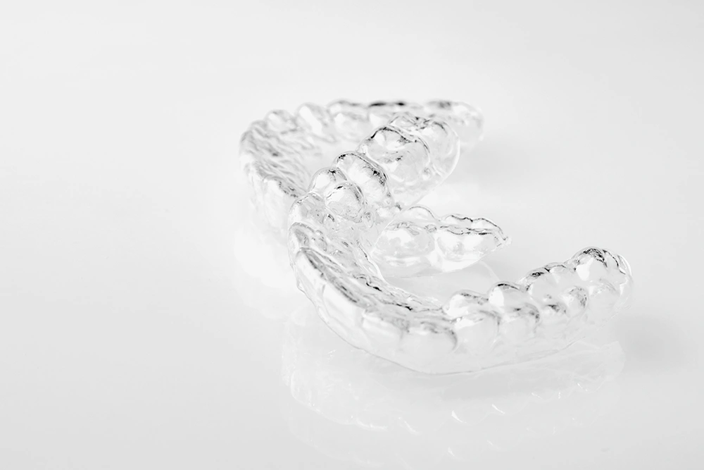 two-invisible-dental-teeth-aligners-on-the-white-b